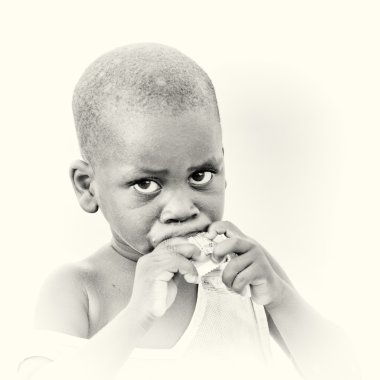 Portrait of the eating Ghanaian boy clipart