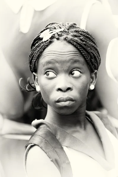 A Ghanaian lady looks on her left — Stock Photo, Image