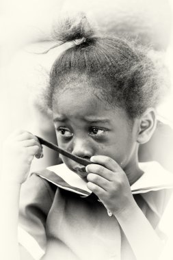 Little Ghanaian girl cries in the school clipart