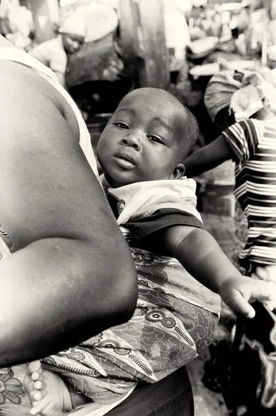 A Ghanaian baby is carried typical way on the back