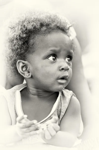 Little girl looks surprised — Stock Photo, Image