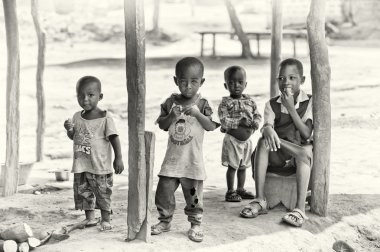 Four children from Ghana poses for the camera clipart