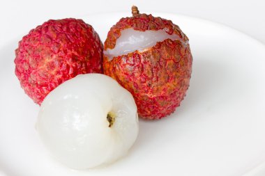 Fresh lychee on the white dish clipart
