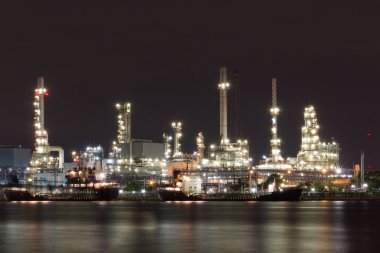 River and oil refinery factory Bangkok, Thailand. clipart