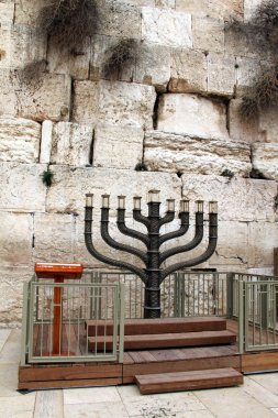 Jewish hanukkah candle holder at the Western Wall clipart