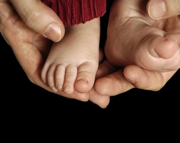 Baby feet isolated on black background — Stock Photo, Image