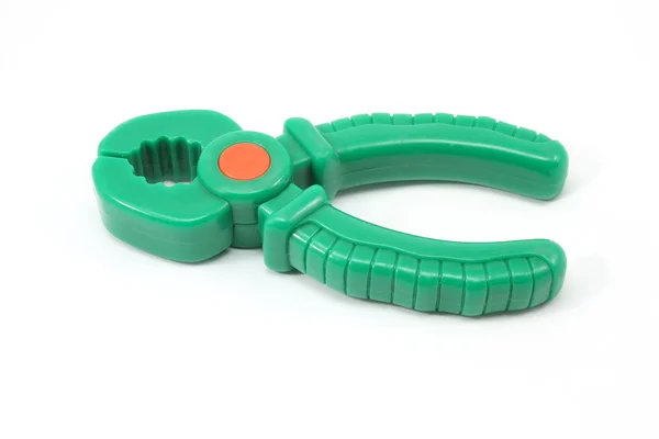 Green toy pliers — Stock Photo, Image