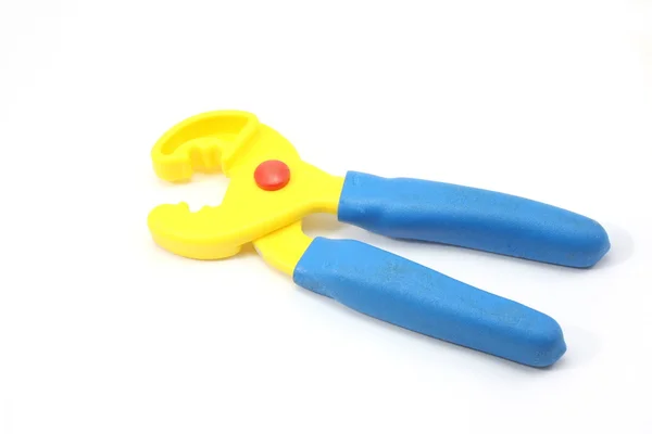 Blue and yellow toy pliers — Stock Photo, Image