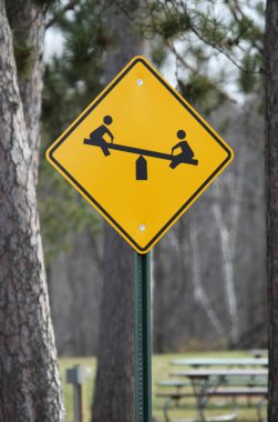 Caution Children at Play Teeter Totter Sign clipart