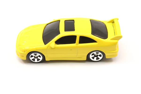Carro de brinquedo amarelo coupe — Fotografia de Stock