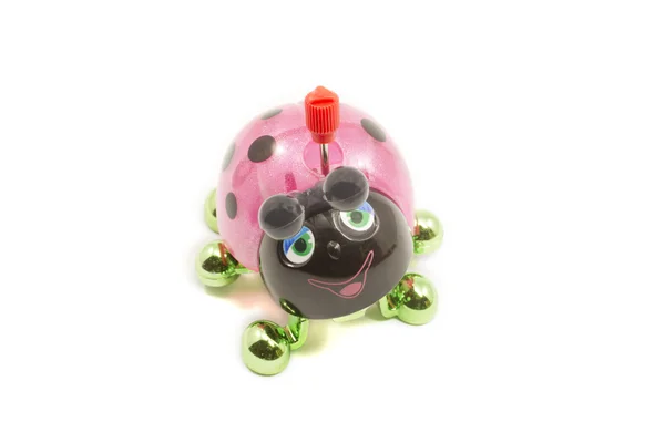 Pembe, siyah ve yeşil oyuncak, ladybug. — Stok fotoğraf
