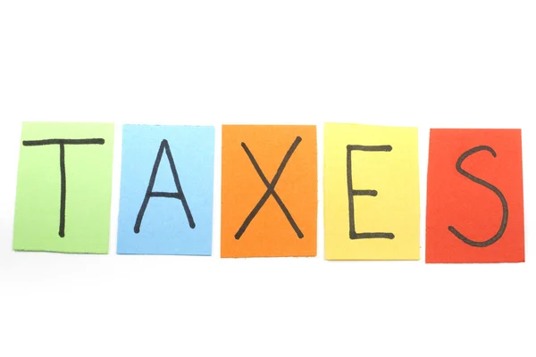 Impostos escritos em letras coloridas — Fotografia de Stock