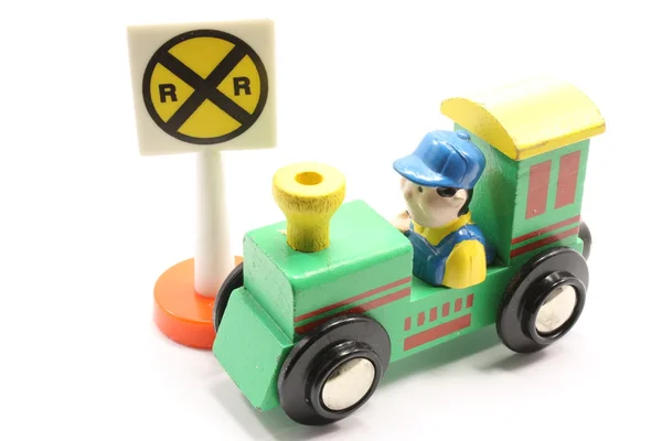 Comboio de brinquedo e travessia — Fotografia de Stock