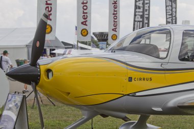 Yellow Cirrus R22 Plane Close up clipart