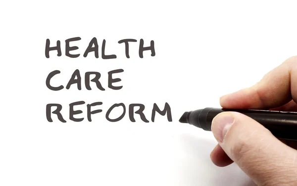 Написать реформу здравоохранения — стоковое фото