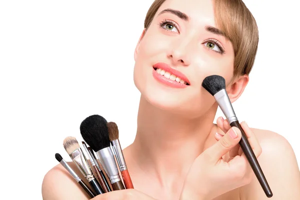 Beautiful woman with makeup brushes - isolated — Stock Photo, Image