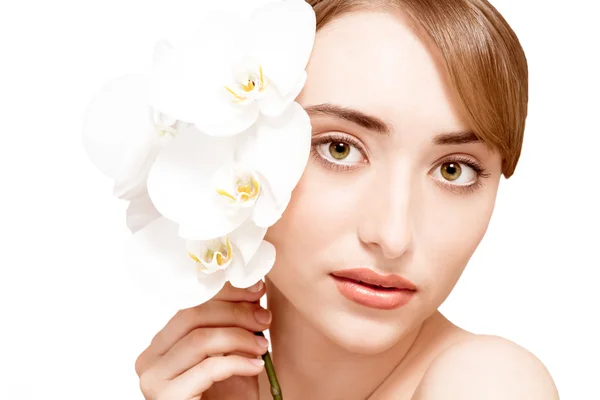 Beauty face of the young beautiful woman with flower — Stock Photo, Image