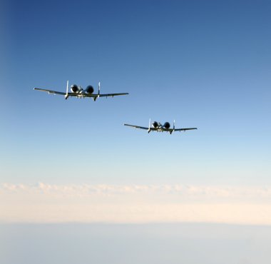 Two jetfighters in flight clipart