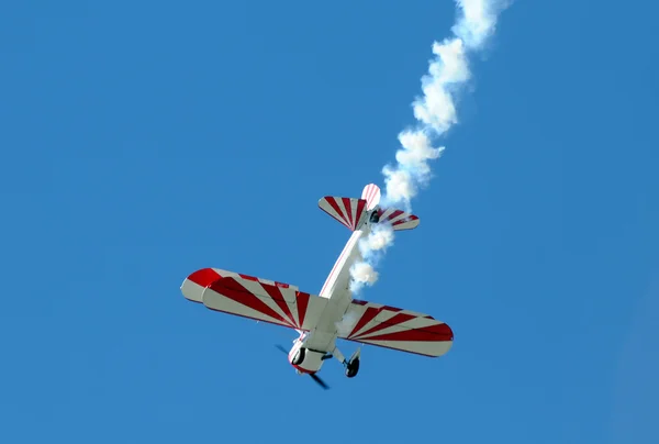 Propeller airplane with smoke — Stock Photo, Image