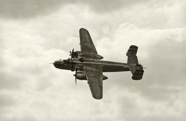 Old bomber in flight clipart