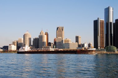 Barge in front of Detroit skyline clipart