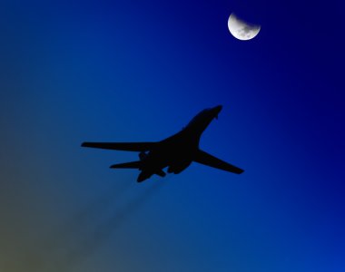 Airplane passing the moon clipart