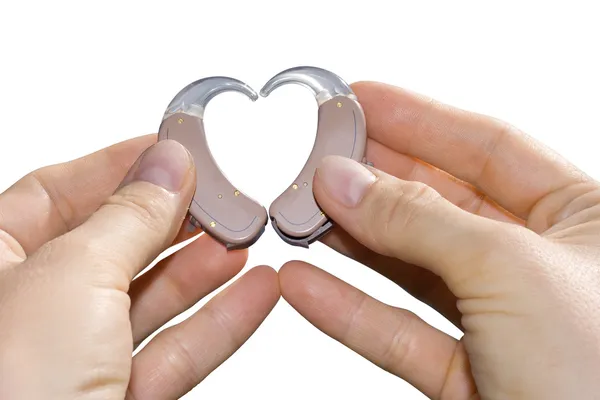 Showing a heart from hearing aids — Stockfoto