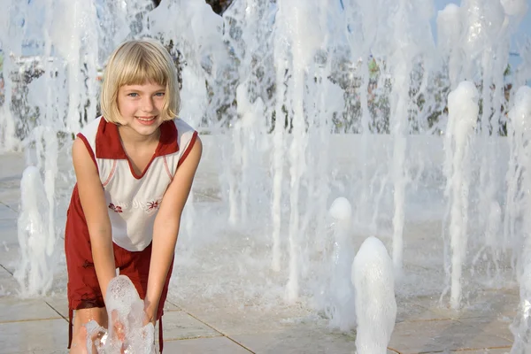 Playing in fountain — Stock Photo, Image