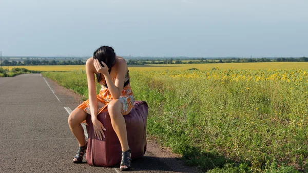 Despondent female hitchhiker — Stock Photo, Image