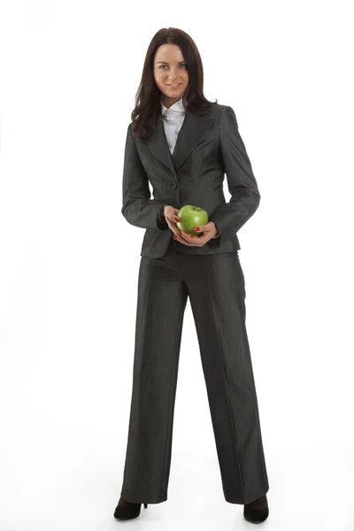 Biznes kobieta w garnitur z zielonym jabłkiem — Zdjęcie stockowe