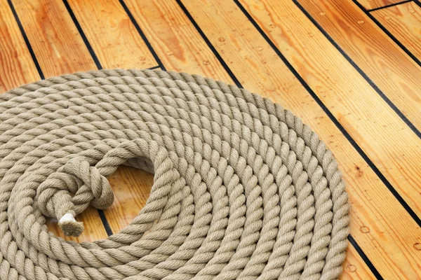 Thick rope on wood floor — Stock Photo, Image
