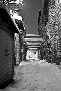 Snowy street in the Old Town of Tallinn, Estonia clipart