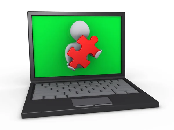 Osoby za pośrednictwem laptopa trzyma kawałek układanki — Zdjęcie stockowe