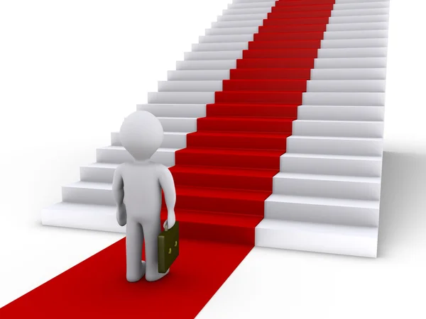 Empresário na frente de escadas com tapete vermelho — Fotografia de Stock