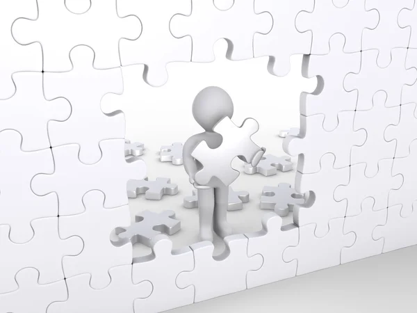 Человек, держащий кусочек головоломки о завершении вертикальной головоломки — стоковое фото