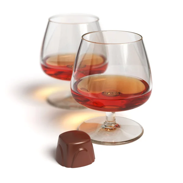 Cognac glasses and chocolate candy — Stock Photo, Image
