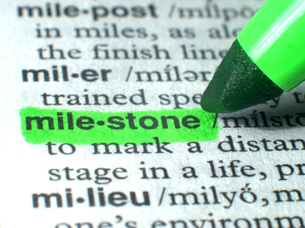 Mile Stone Highlighted In Dictionary In Green — Stock Photo, Image