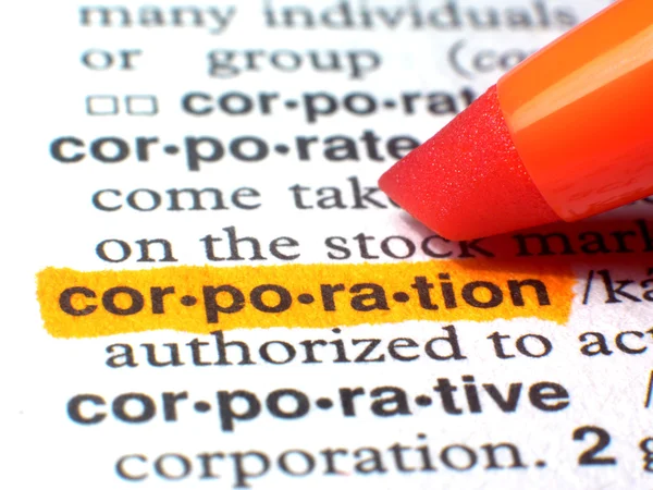 Corporation mis en évidence dans le dictionnaire en orange Photos De Stock Libres De Droits
