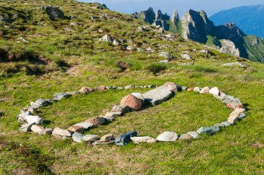 Stone circle sign in the mountains clipart