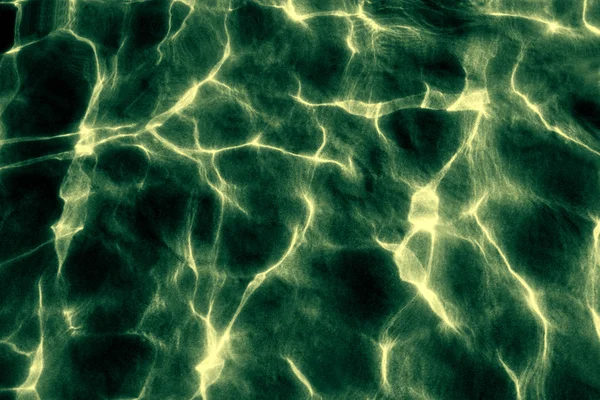 Achtergrond van chaotische lijnen van patches van licht in water. — Stockfoto