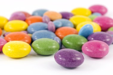 Colored candy filled with chocolate clipart