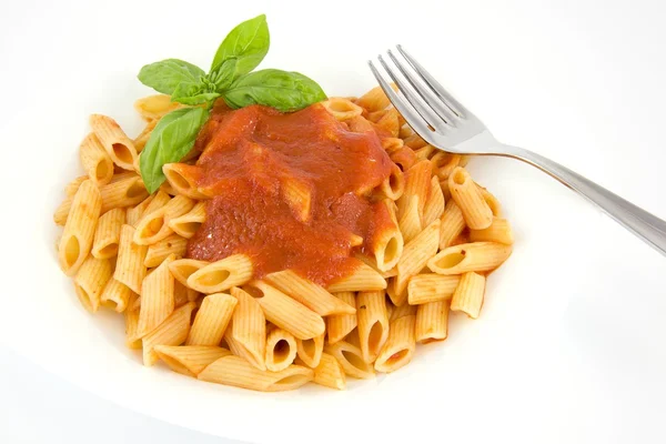 Penne with tomato sauce and basil Stock Photo