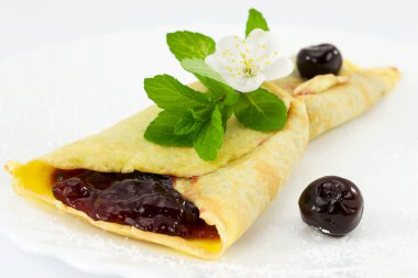 Crepes with black cherry jam clipart