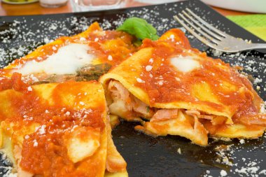 Crepes stuffed with ham and mozzarella clipart