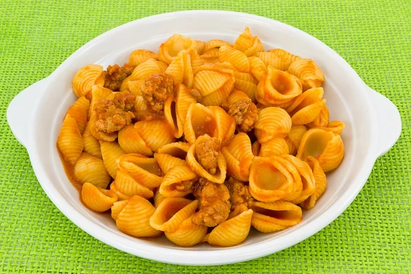 Shells in tomato sauce with sausage — Stock Photo, Image