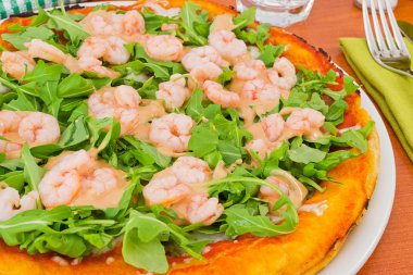 Pizza with arugula and shrimp with cocktail sauce clipart