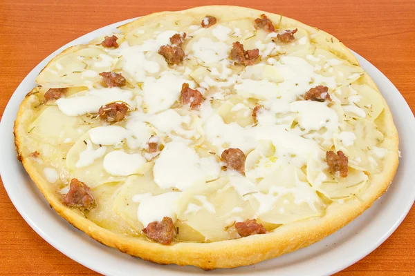 Pizza with potatoes and sausage in pieces — Stock Photo, Image