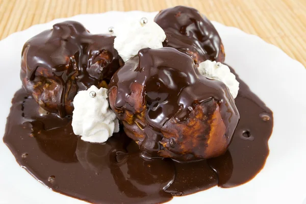 Chocolate profiteroles — Stock Photo, Image