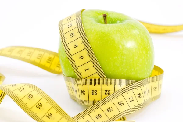 stock image Green apple measured the meter