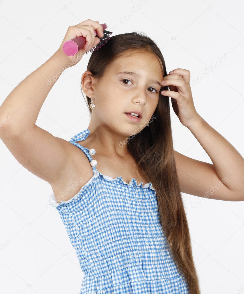 Beautiful little girl combing her long hair — Stock Photo © darkoilic ...